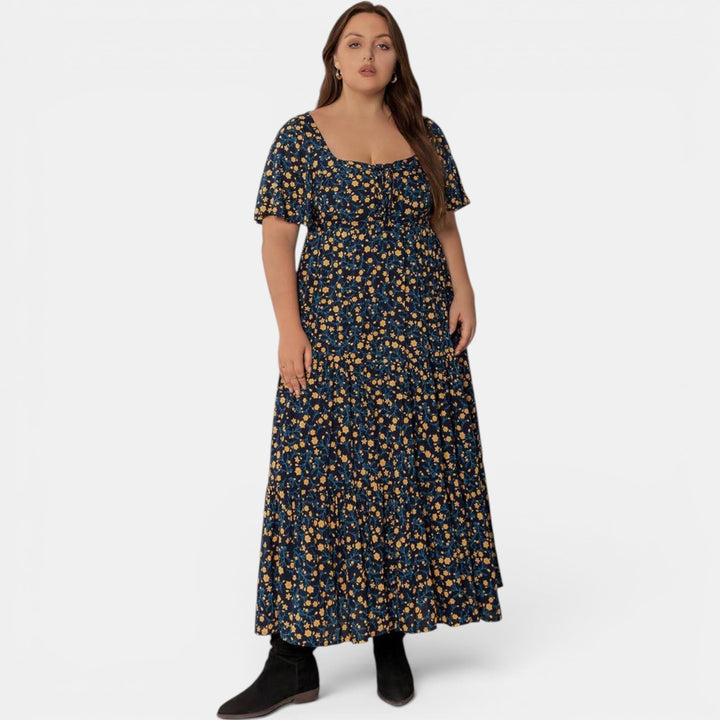 Graceful floral maxi dress for women, an elegant A-line summer design with a delicate print.