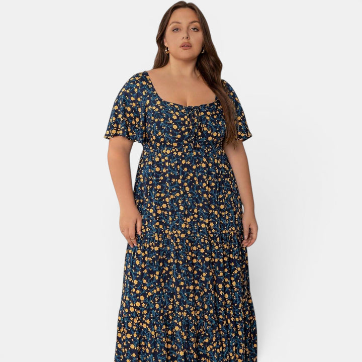 Chic floral maxi dress, women's elegant A-line style perfect for summer vacations. Flowing fabric.