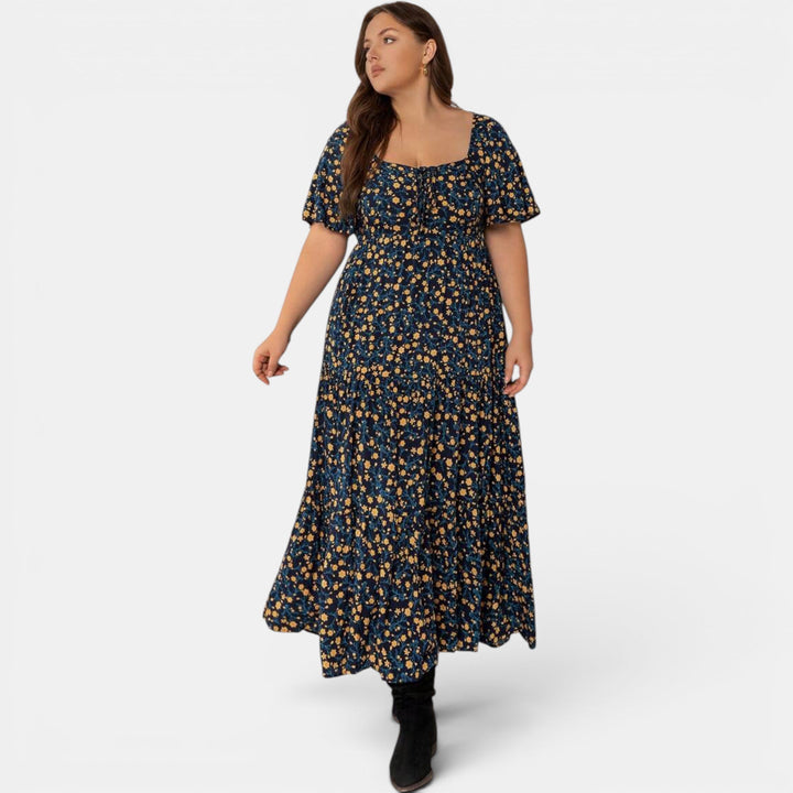 Casual women's floral print maxi dress, elegant and breezy, perfect for warm weather.