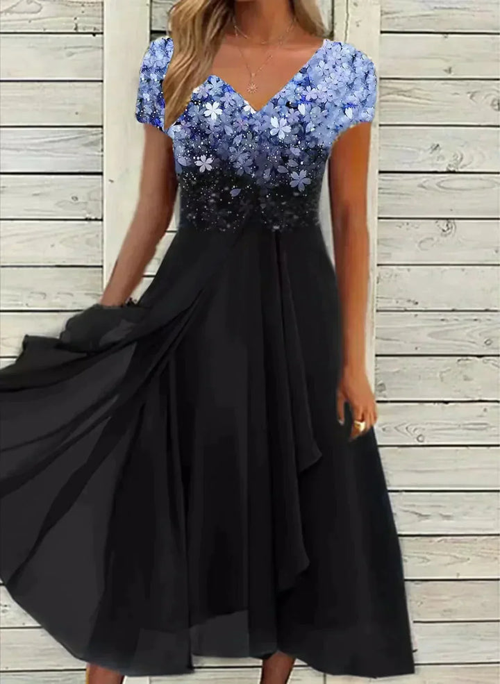 Women's elegant floral maxi dress, perfect for wedding guests or evening parties. Romantic and flowy multicolor design.