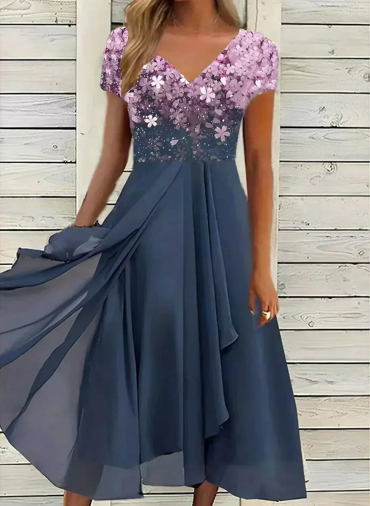 Elegant women's floral print formal dress, perfect for wedding guests, evening events, or special occasions. Flowy silhouette.
