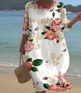 Elegant women's floral print dress. Timeless design and comfortable fit, ideal for special occasions or summer.