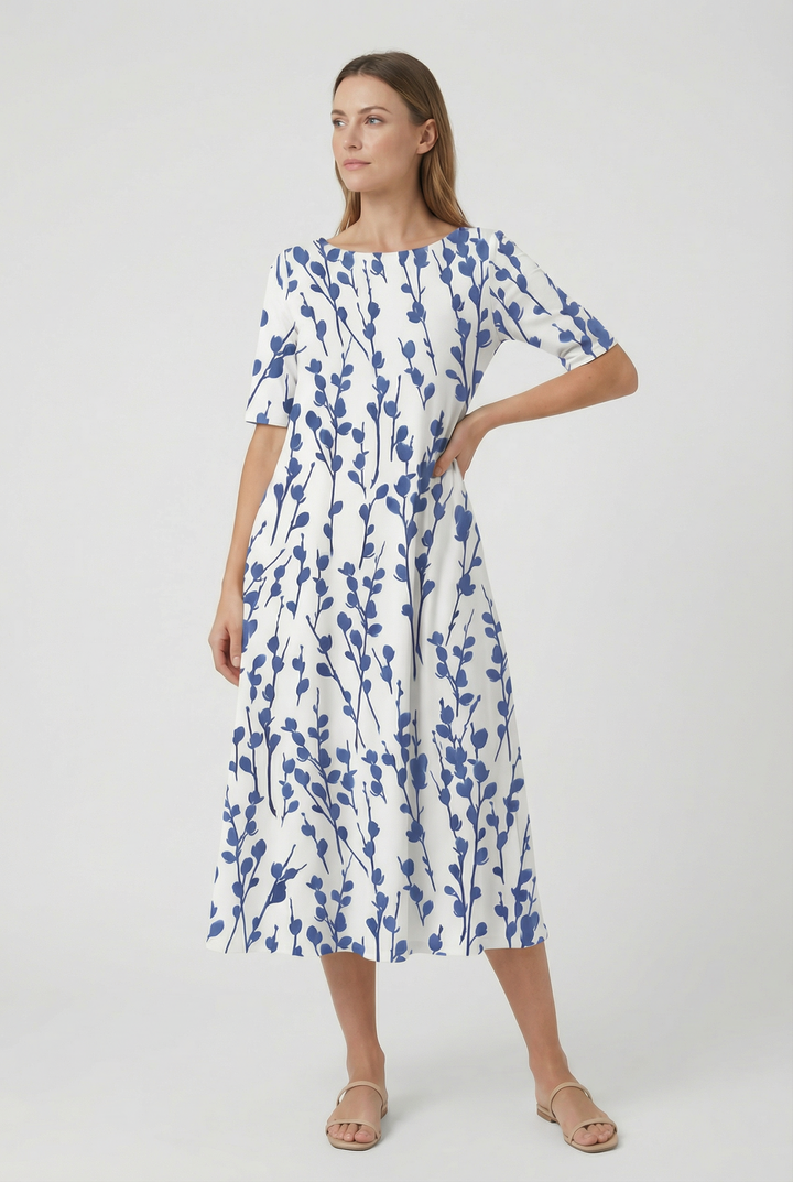 Chic floral midi dress for women, featuring a flattering high neck and convenient pockets.