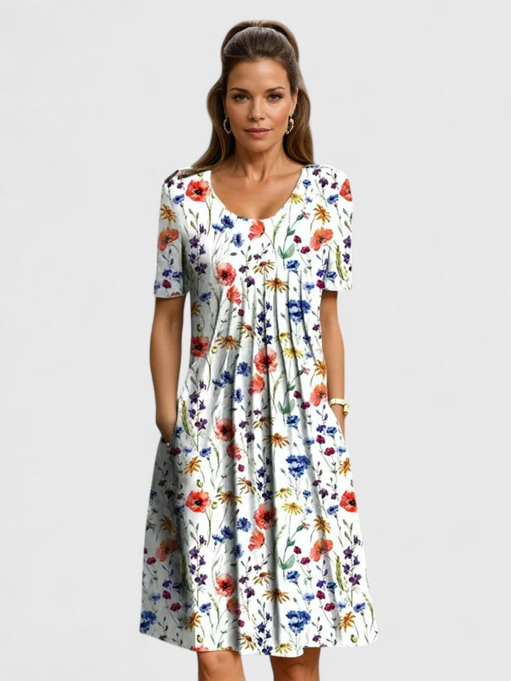 Chic women's midi dress showcasing a vibrant floral pattern, an elegant and comfortable choice for any event.