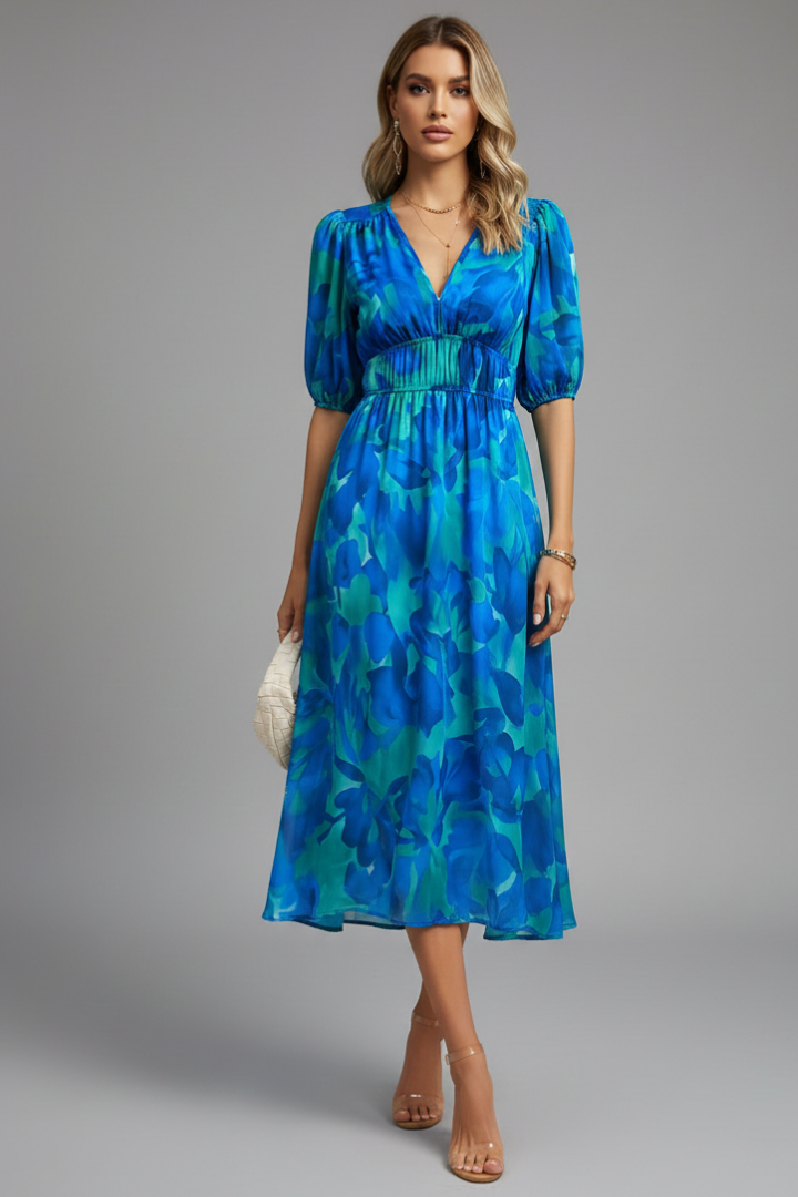 Detail of a women's floral puff sleeve V-neck midi dress, highlighting the vibrant print & sleeve design.
