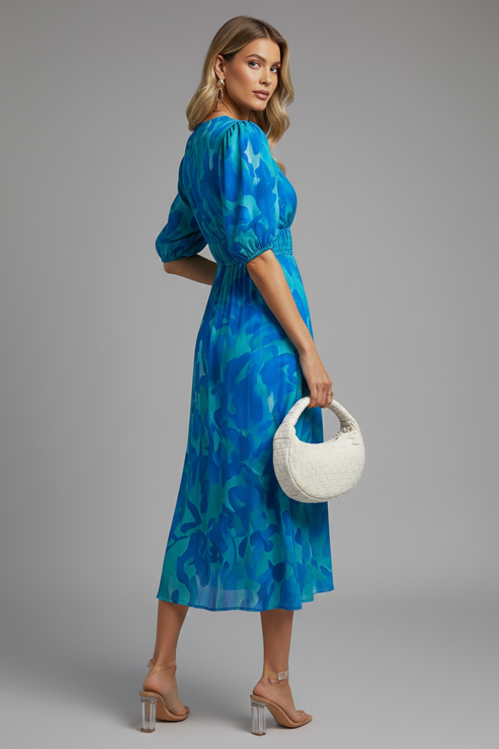 Flowy women's summer floral midi dress with puff sleeves & V-neck, perfect for an elegant party or daytime outing.