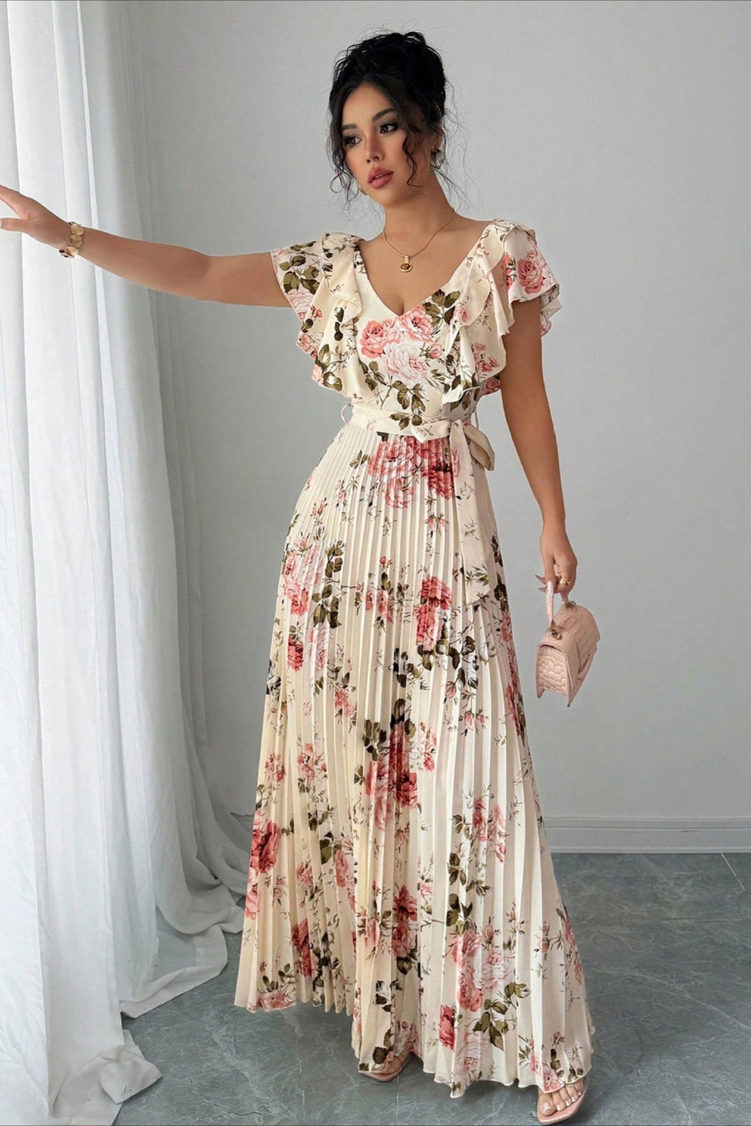 Flowy floral print maxi dress for women, featuring a pleated skirt and stylish ruffle sleeves.