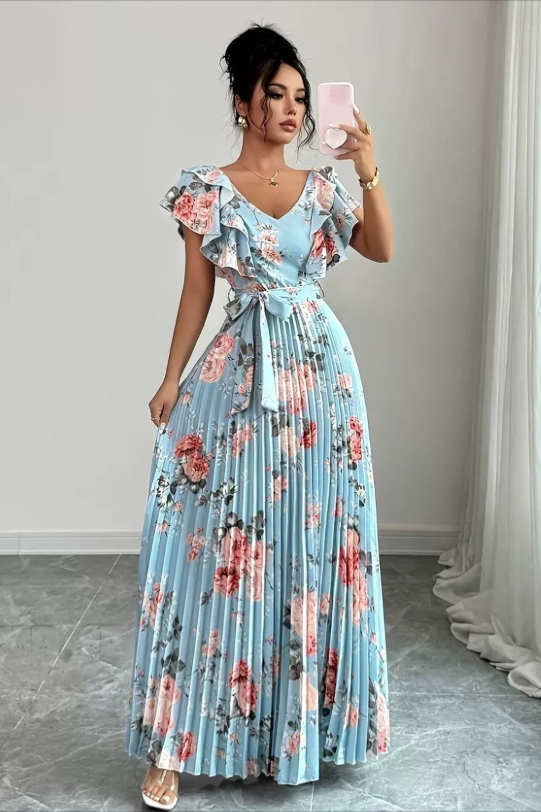Beautiful women's floral pleated dress with flowy maxi length and elegant ruffle sleeves for parties.