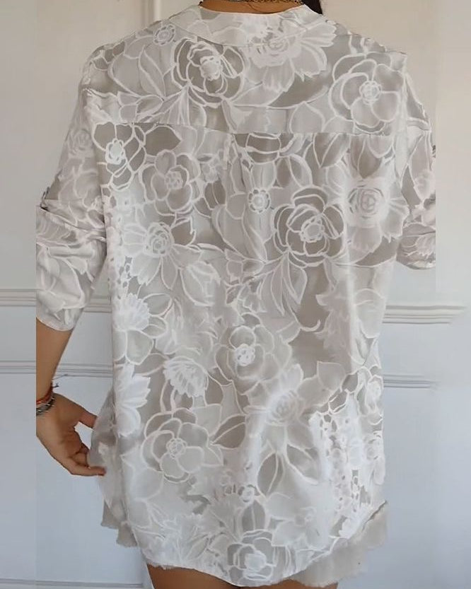 Women's elegant floral pocket blouse, a comfortable & stylish relaxed fit top for casual wear.