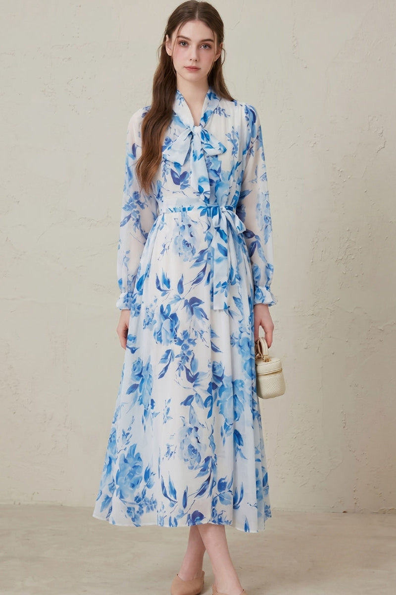 Full-length view of a women's belted floral print long sleeve maxi dress, showcasing its elegant design.
