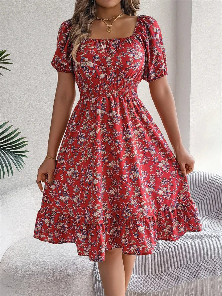 Gorgeous women's floral smocked midi dress with puff sleeves and a flattering square neckline.