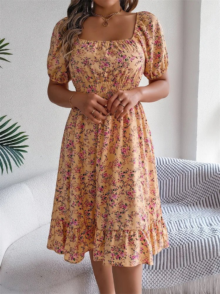 Women's stylish floral midi dress, smocked for comfort, puff sleeves, perfect for a chic look.