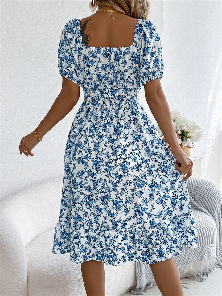 Casual women's smocked floral midi dress with puff sleeves and a chic square neckline.