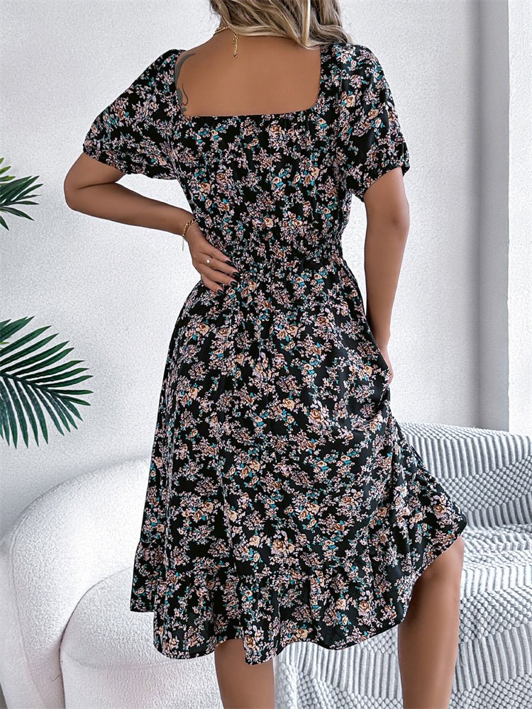 Stylish women's puff sleeve floral midi dress, smocked design, suitable for elegant or casual wear.