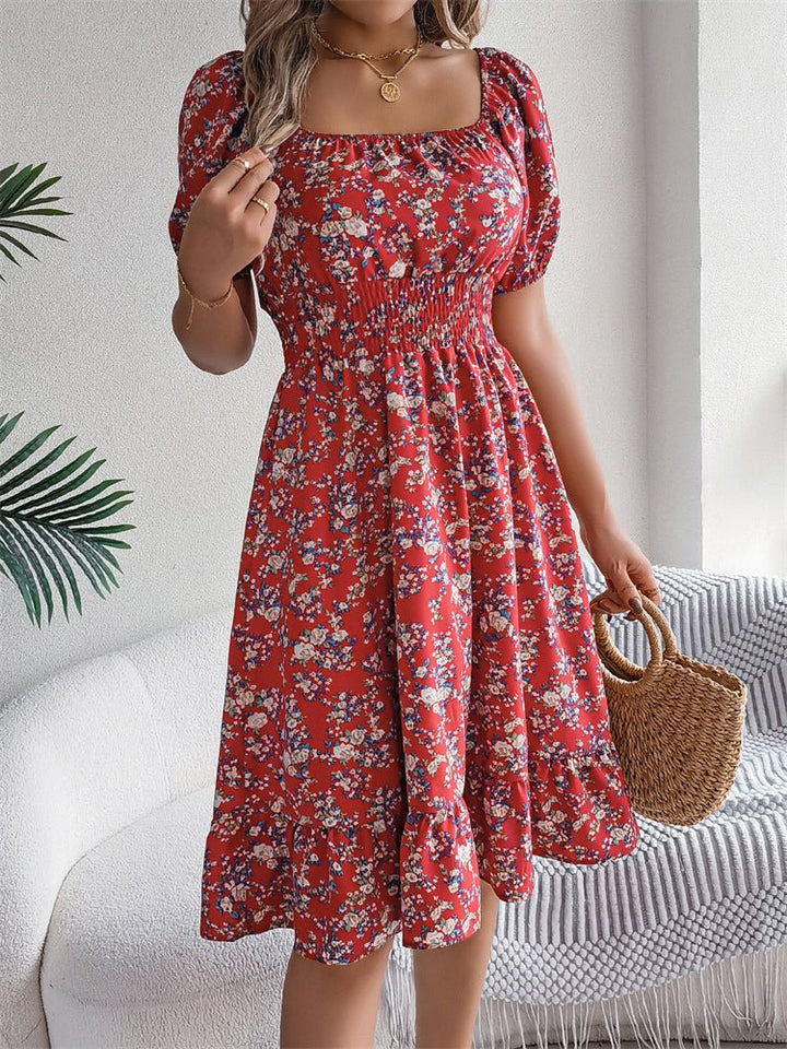 Trendy women's floral midi dress with smocked detail, puff sleeves, ideal for autumn style.