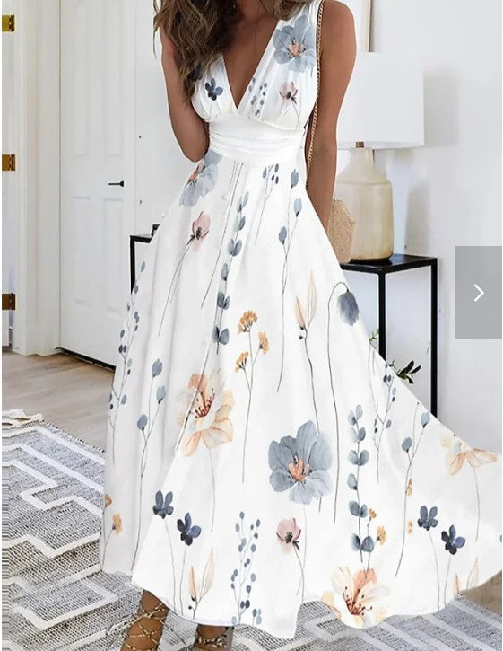 Chic wedding guest maxi dress with a delicate floral print, V-neck, and elegant A-line cut for spring events.