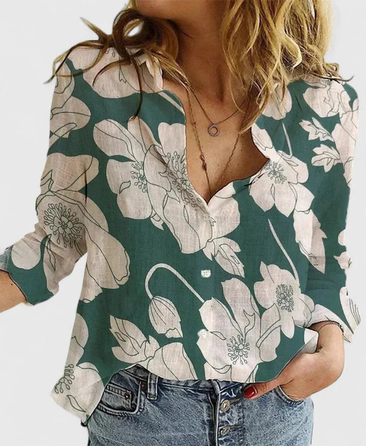 Chic women's floral V-neck top with long sleeves, relaxed fit design. Elegant spring fashion blouse.
