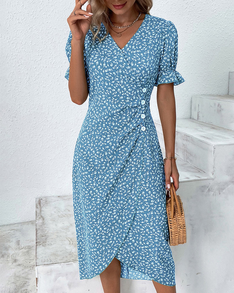 Detail of the V-neckline and wrap waist on a beautiful floral print midi dress for women.