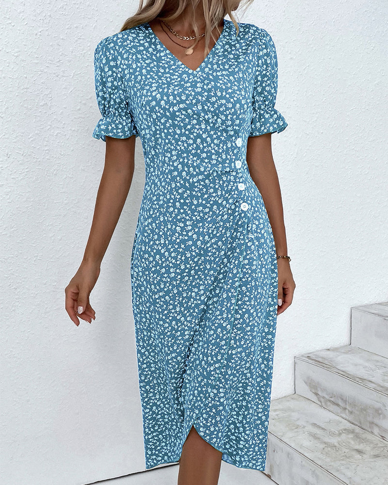 Close-up of the beautiful floral pattern on a women's V-neck wrap midi dress.