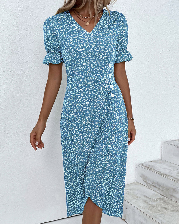 Close-up of the beautiful floral pattern on a women's V-neck wrap midi dress.