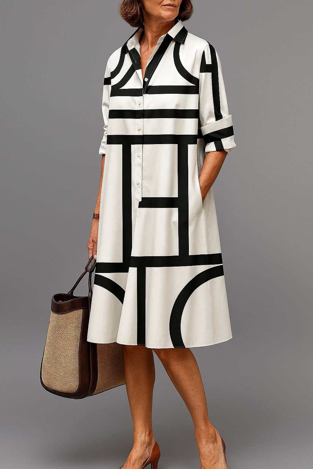 Women's elegant flowing midi dress. Versatile casual chic style, comfortable for summer & spring. Black & white design.