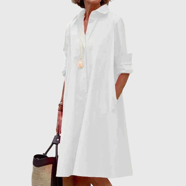 Stylish women's flowy dress featuring convenient pockets, great for everyday wear.