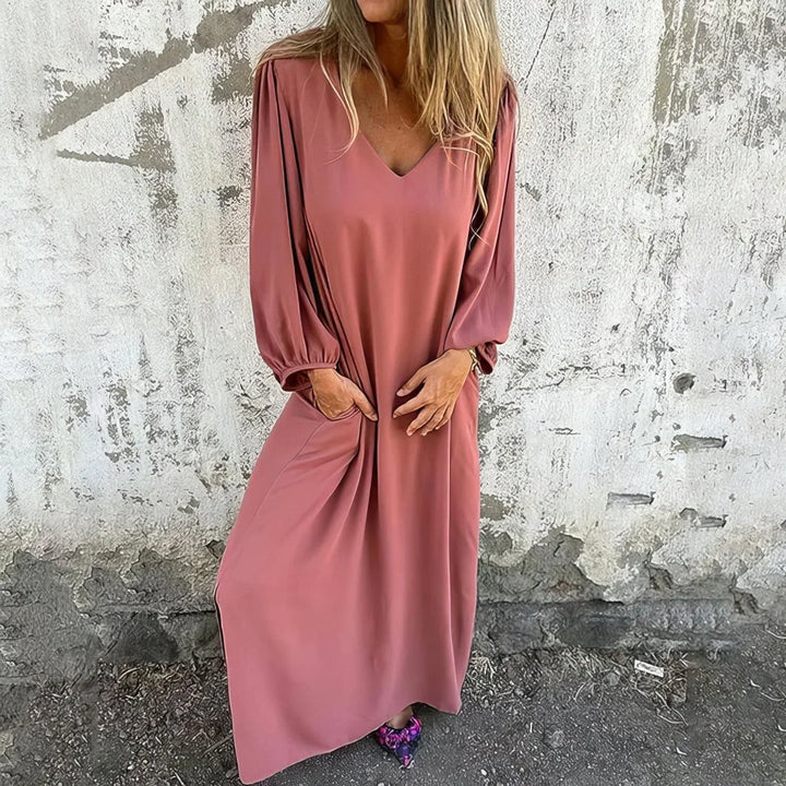 Casual long maxi dress for women, featuring a flattering V-neck, chic bishop sleeves, and convenient pockets.