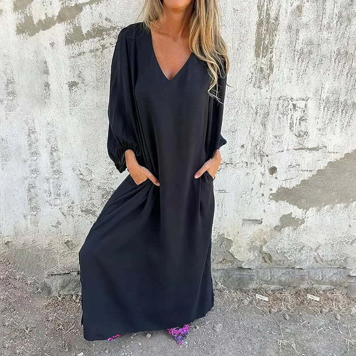 Boho-style women's plus size maxi dress with a V-neck, flowy skirt, and bishop sleeves, ideal for parties.