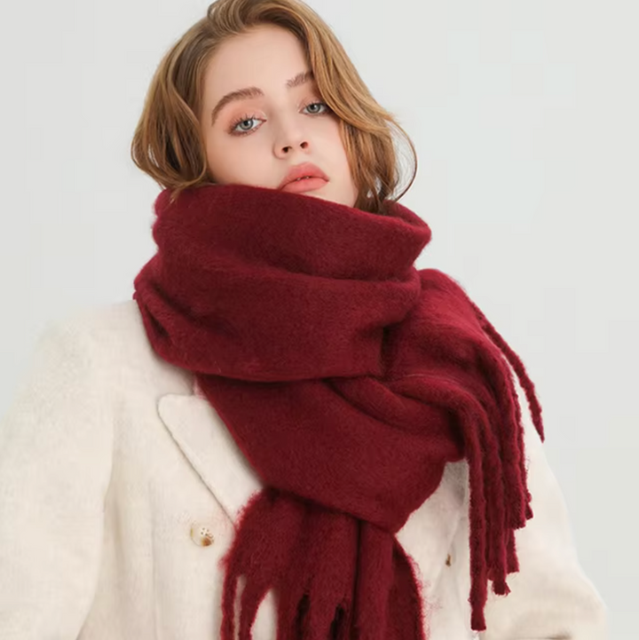 Women's elegant fringe winter scarf in classic black, perfect for cozy warmth.