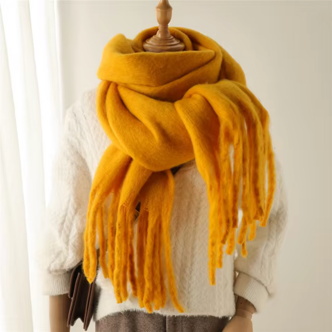This women's winter scarf combines elegance with cozy warmth and fringe detail.