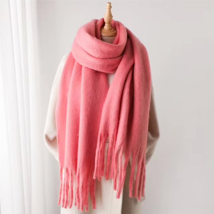 A beautifully crafted women's winter scarf with a chic fringe detail.