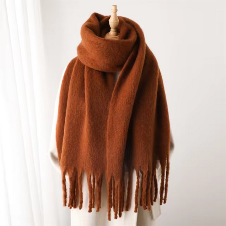 Stay warm and fashionable with this elegant, cozy fringe scarf.