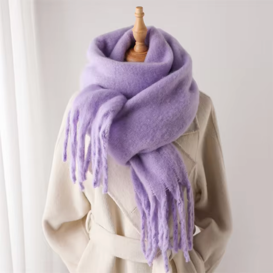 Elegant women's winter fashion: a warm scarf with stylish fringe.