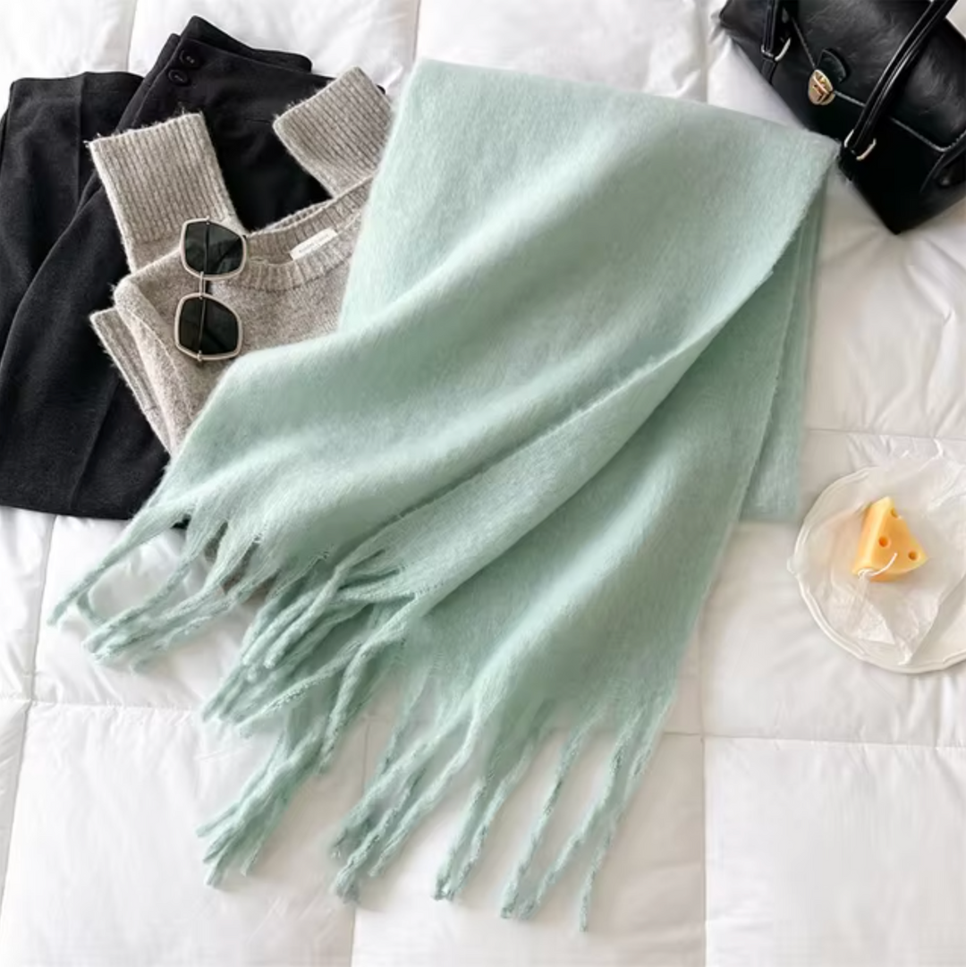 This cozy fringe scarf is the ultimate elegant accessory for women.