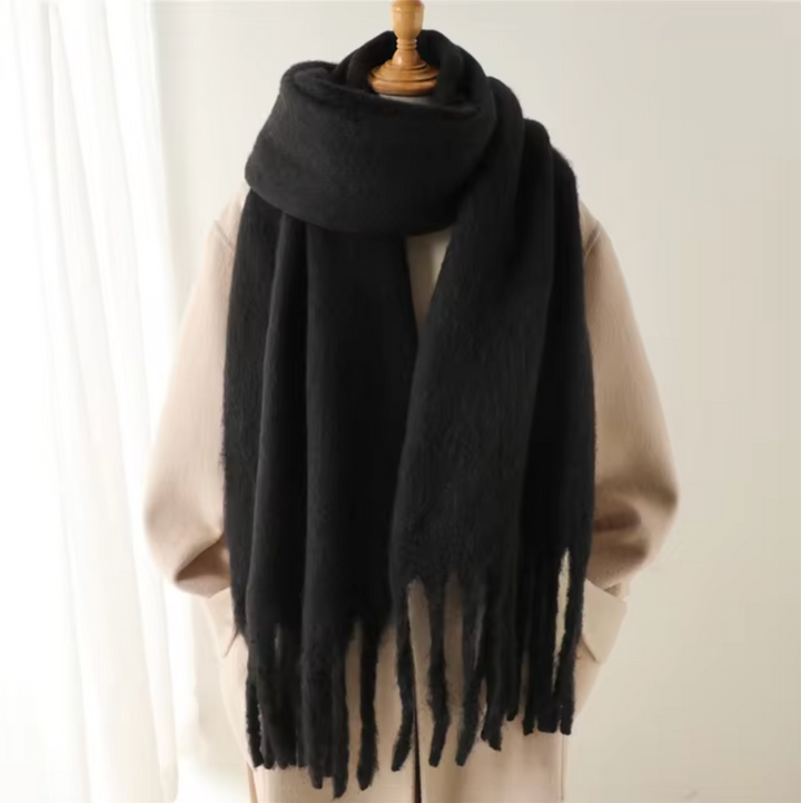 A fashionable women's accessory: a warm and cozy fringe scarf for winter.