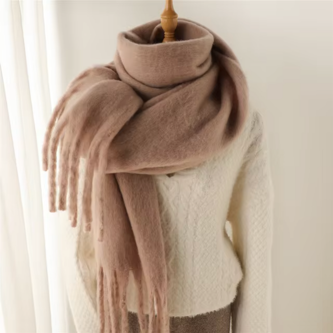 Elegant winter scarf for women, featuring a stylish fringe and soft material.