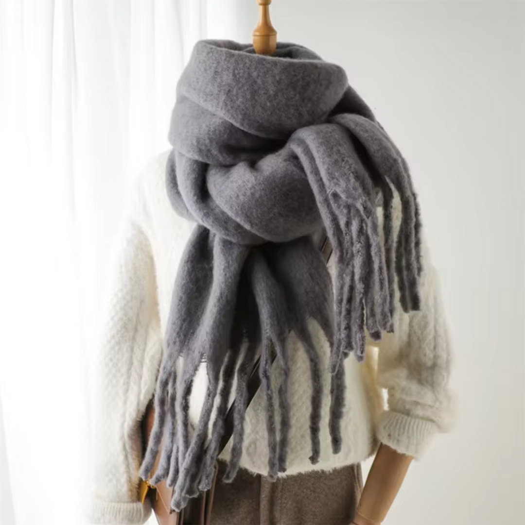 Cozy and warm fringe scarf, an essential women's accessory for cold weather.