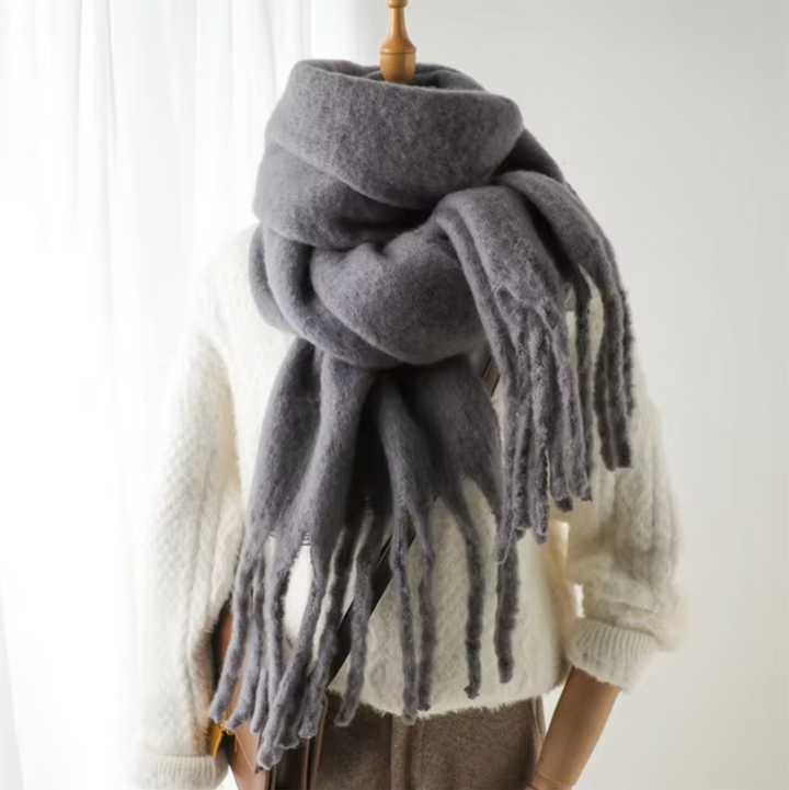 Cozy and warm fringe scarf, an essential women's accessory for cold weather.