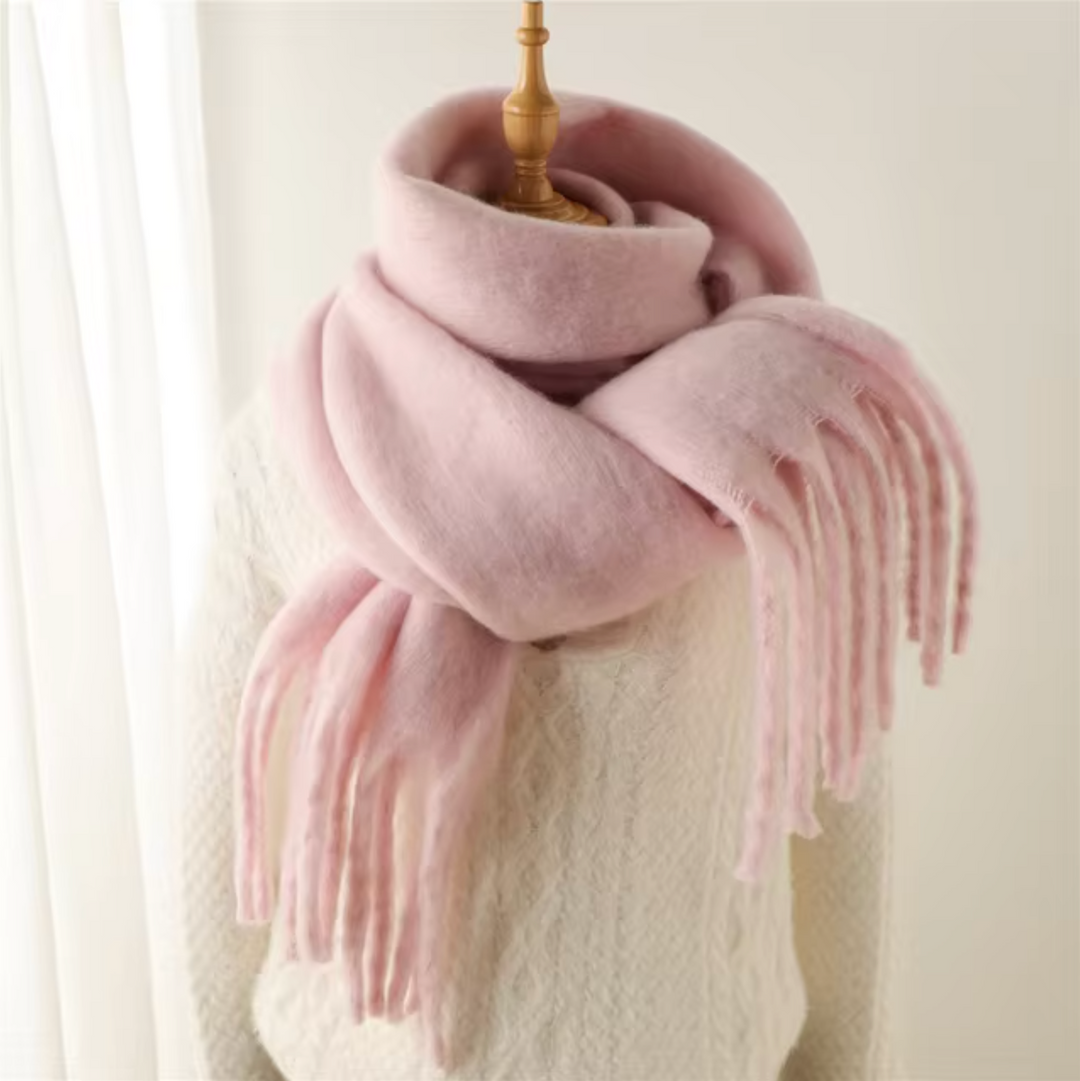 Model demonstrating the fashionable drape of the warm, cozy fringe scarf.
