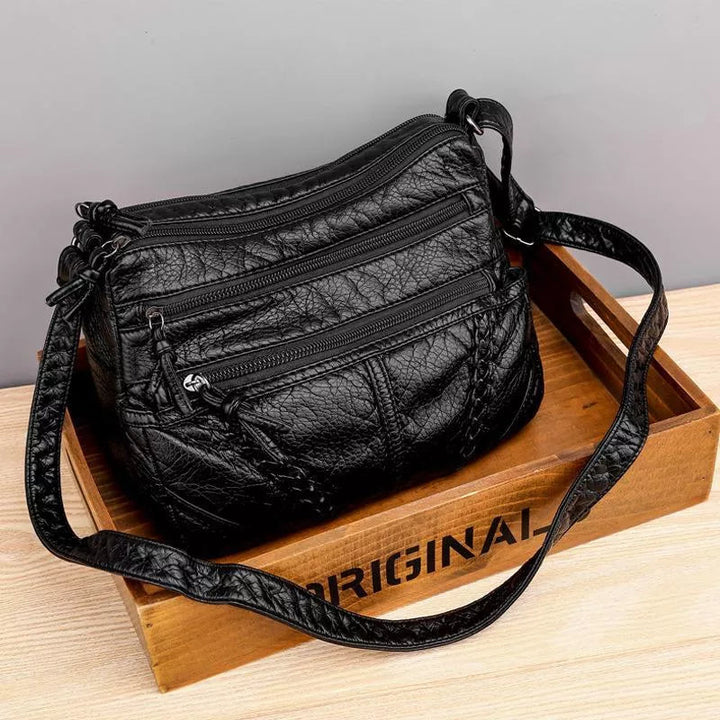 Designer inspired women's leather bag, a chic and elegant accessory for any occasion.