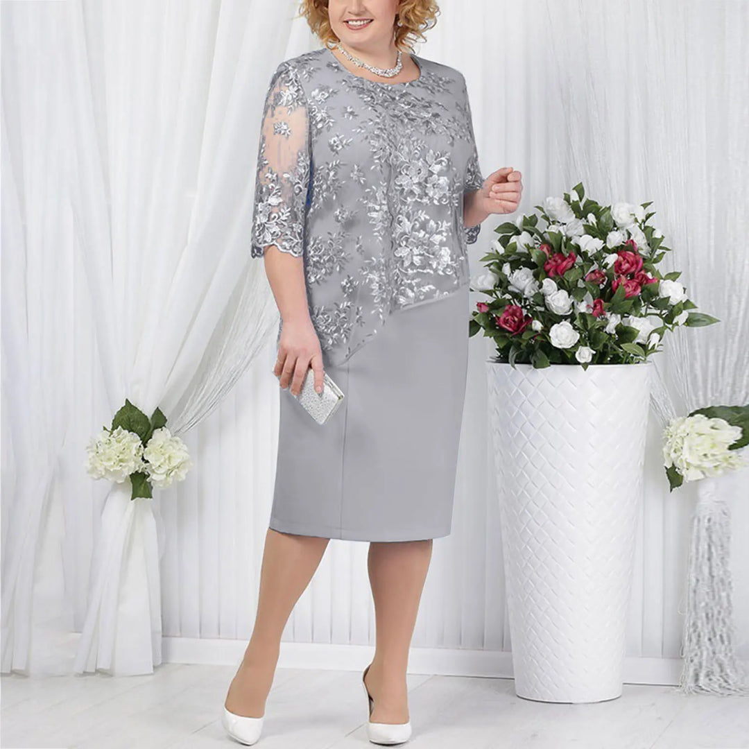 Sophisticated women's party dress, grey, with exquisite floral embroidery and an overlay design.
