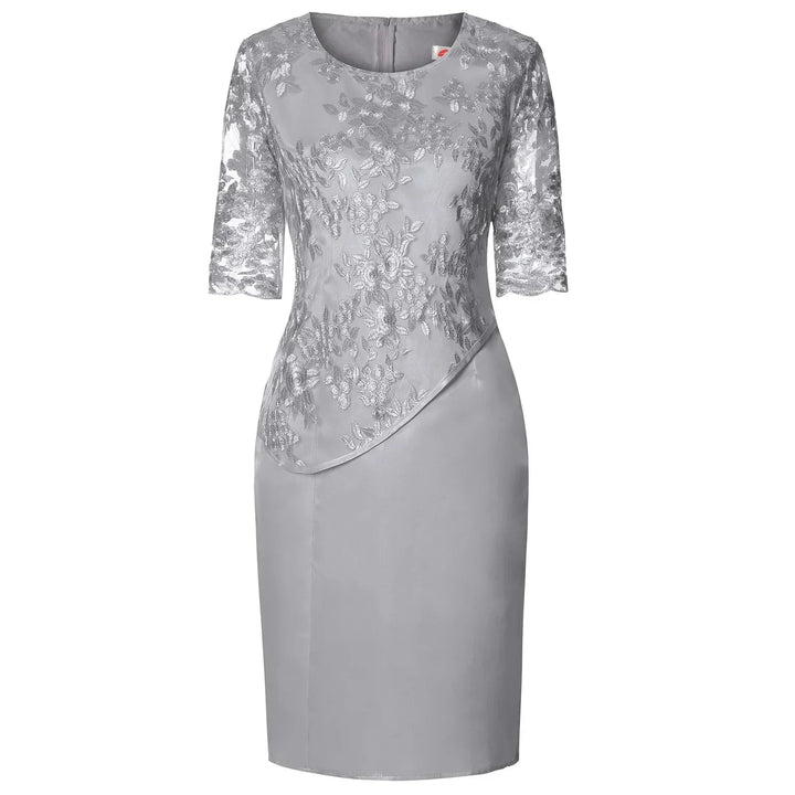 Pink plus size elegant knee-length dress featuring beautiful floral embroidery & a sheer overlay.
