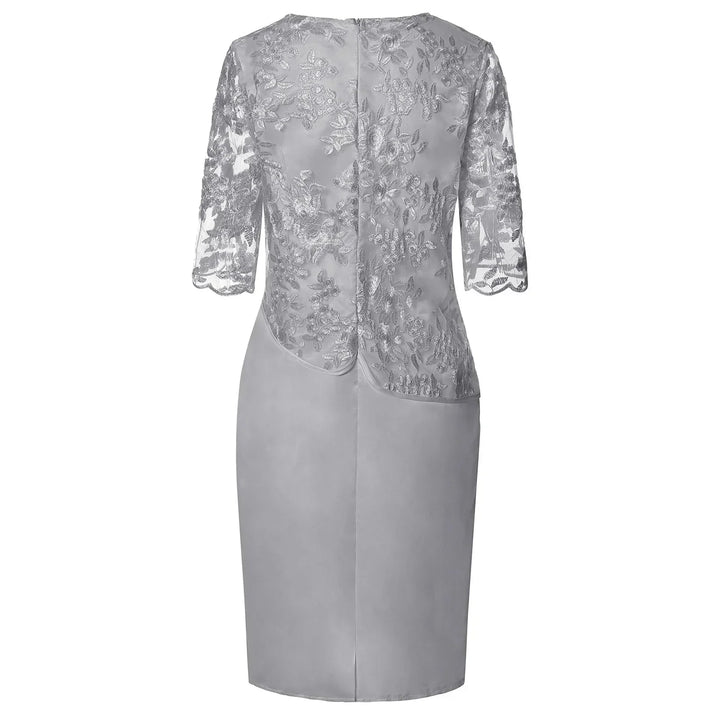 Women's pink elegant embroidered overlay knee-length party dress with a round neck and short sleeves.