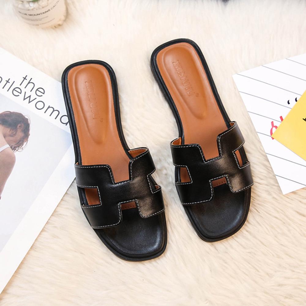 Stylish low heel leather sandals for women, featuring a chic H-strap design.