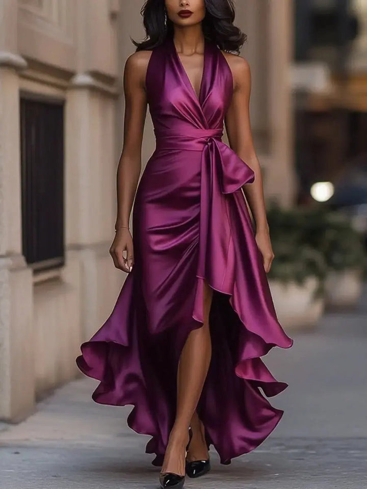 Women's elegant halter high-low satin cocktail dress, bow waist, and stunning flowing hem for parties.