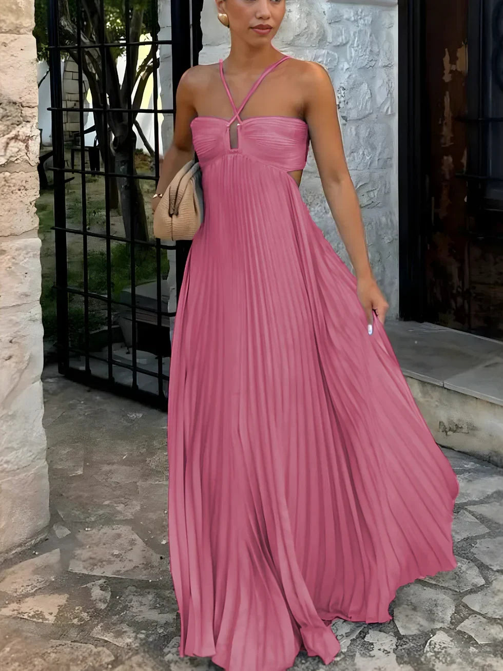 Flowy women's pleated maxi dress with a sophisticated halter neckline & flattering high-waist design.