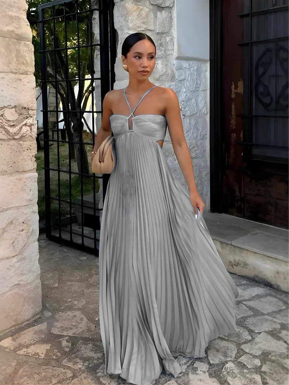 Summer-ready women's sleeveless halter neck pleated maxi dress with stylish cut-outs & high waist for elegance.