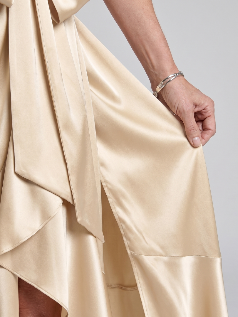 Elegant women's party dress: halter neck, asymmetric midi, flattering wrap style.