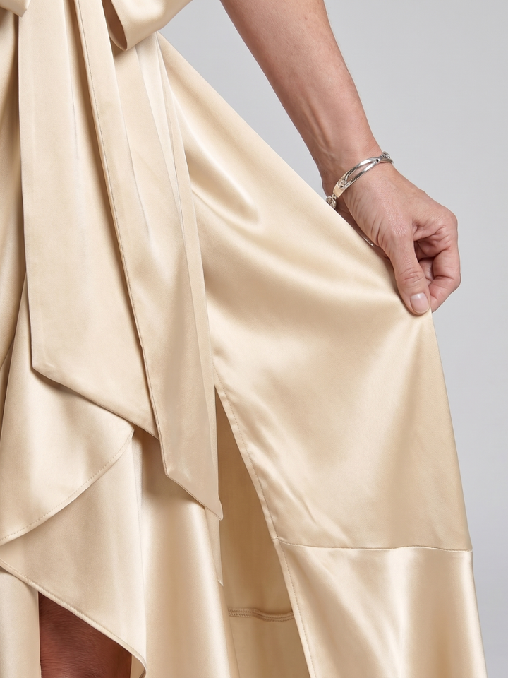 Elegant women's party dress: halter neck, asymmetric midi, flattering wrap style.