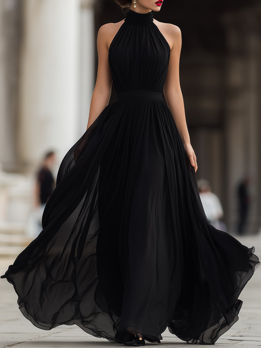 Stylish women's black halter neck pleated long maxi dress, ideal for evening events & special occasions.